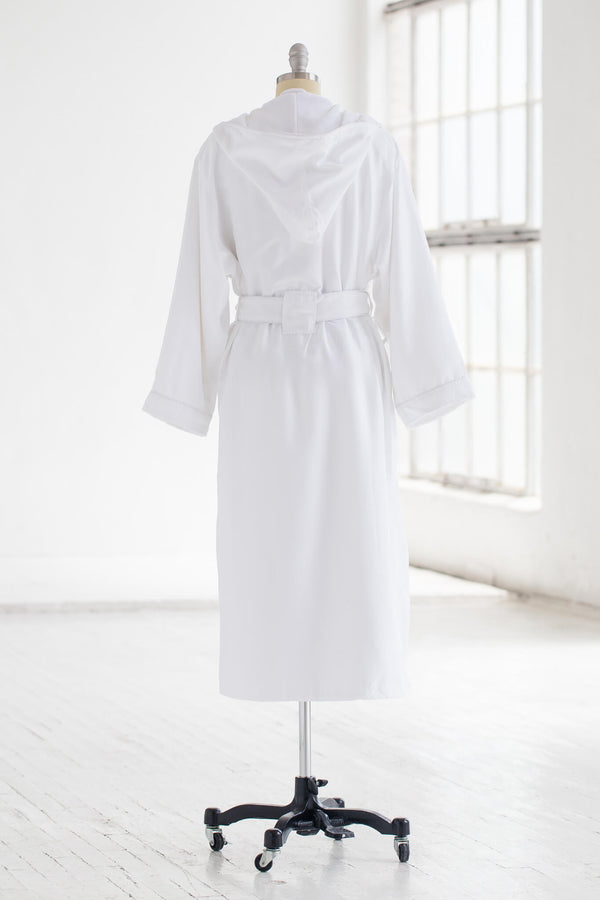 Back of a belted, white, hooded robe on mannequin against a white background.